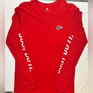 Nike L red men’s tee,  bold swoosh chest hit, “JUST DO IT” sleeve print.